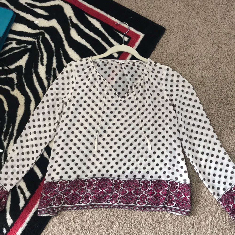 white and pink blouse.